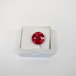 A loose 8.07 carat round ruby with GIL Laboratory Certificate.