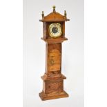 A miniature wooden longcase clock, height 40cm.