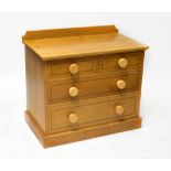 A modern oak bespoke made chest of two short over two long drawers,