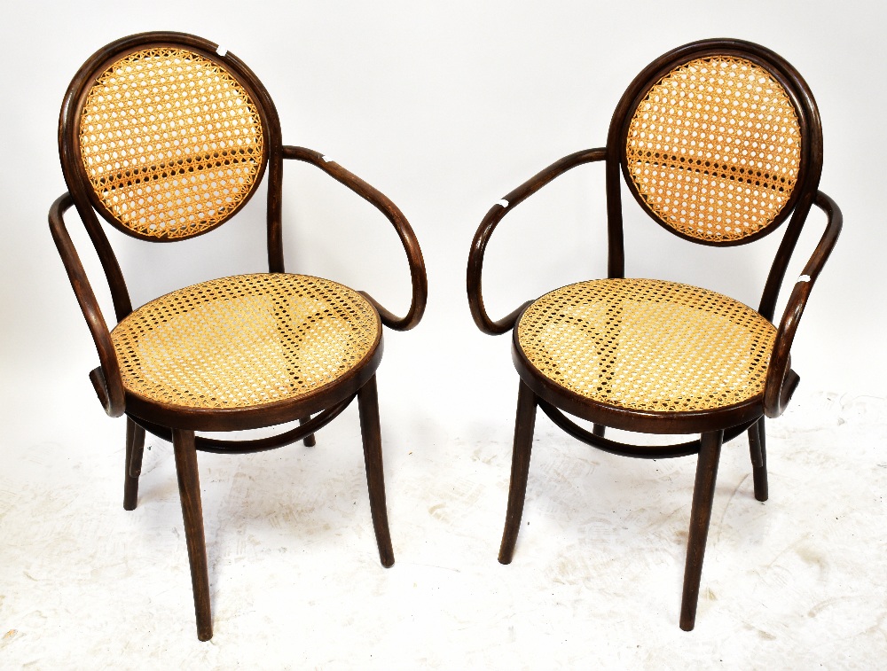 A set of four early 20th century bergère caned bentwood open arm elbow chairs,