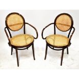 A set of four early 20th century bergère caned bentwood open arm elbow chairs,