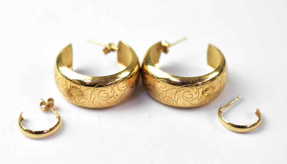 A pair of 9ct gold large wide hoop earrings with scroll decoration and a pair of small 3/4 hoop