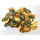 Fifty gilt metal and green enamel unicorn badges.