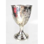 An Elizabeth II hallmarked silver Arts & Crafts silver goblet, with hammered bowl and fern leaves,