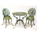 A painted aluminium garden table and four chairs with pierced foliate decoration and on cabriole