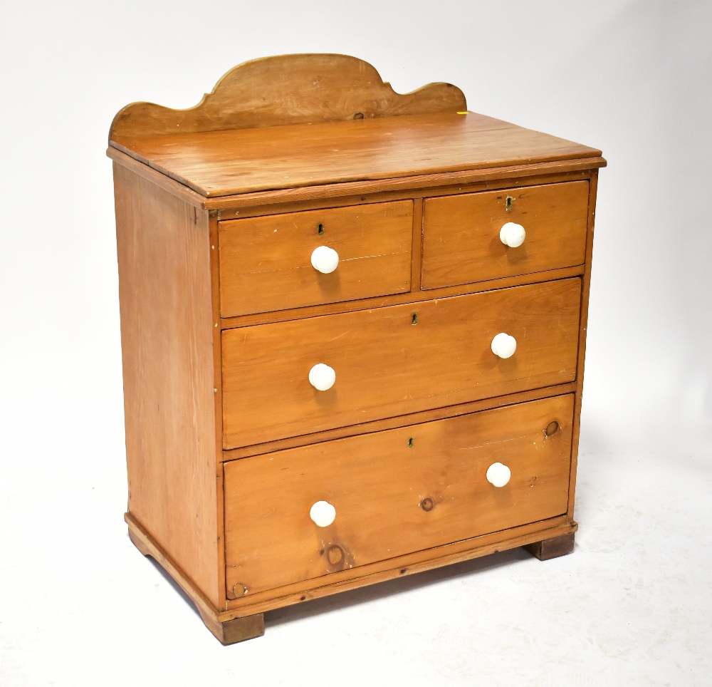 An early 20th century stripped pine wash stand with curved or shaped back,