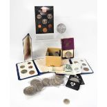 A collection of mixed collectors' coins and notes to include coin packs, commemorative coins,