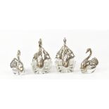 A pair of hallmarked silver mounted swans, the neck,