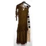 A group of textiles from various eras, to include a c1920s chiffon and heavily beaded evening dress,