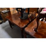 An early 20th century mahogany wind-out extending dining table,