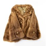 A 1960s mink short jacket with revere collar and satin lining.