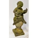 A cast garden statue of a putti seated cross-legged playing a lyre,