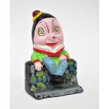 An early 20th century painted cast iron 'Humpty Dumpty' money box, height 13cm.