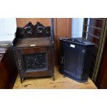 Two antique wall-mounted cabinets to include a smokers' cabinet with oak leaf carved panel to the