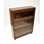 An early 20th century three-section graduated stacking bookcase,