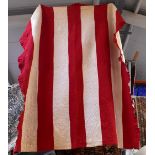 A vintage Durham quilt, red and cream stripes with fabric frill to border, 204 x 180cm.