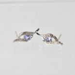 A pair of 9ct white gold stud earrings with central blue stone and small white stones.