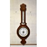 An early 20th century mahogany inlaid aneroid wall barometer in the banjo style, inlaid with swags,