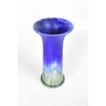 RUSKIN POTTERY; a vase of cylindrical form with flared rim,