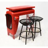 A modern painted metal bar/outside table modelled as the front of a tractor,