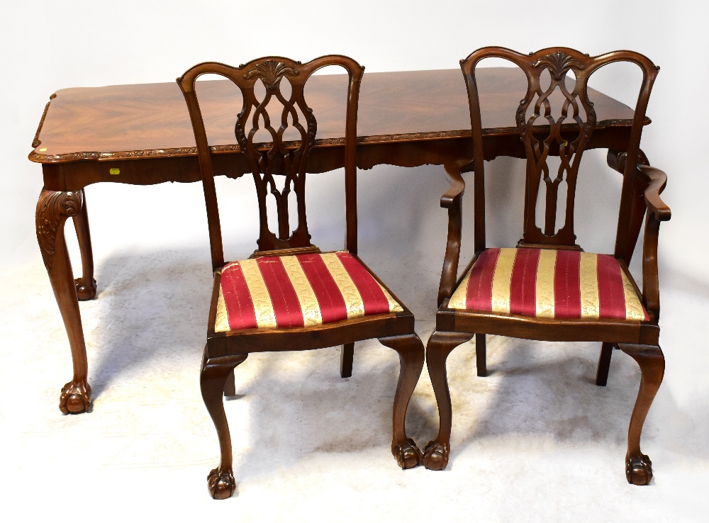 A reproduction Regency dining table with flame mahogany effect top,