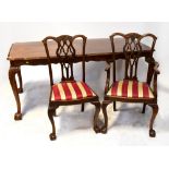 A reproduction Regency dining table with flame mahogany effect top,