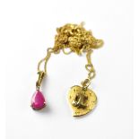 Two 9ct gold necklaces, one with a pear-shaped claw set ruby on a 9ct gold frame,