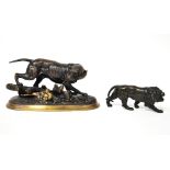 A bronzed figure of a dog on an oval stylised base with fallen tree stump and duck floating by on a