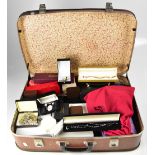 A vintage suitcase containing a large quantity of vintage and contemporary costume jewellery,