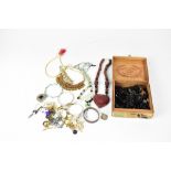A quantity of costume and mourning jewellery to include jet beads, silver Christening bangle,