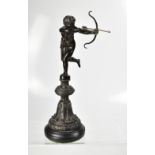 A 20th century bronze figure of Eros, with bow, arrow and quiver, standing on one leg,