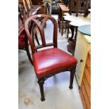 Three 19th century mahogany Gothic-style balloon back dining chairs with red leather upholstered