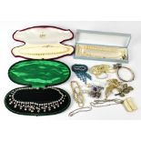 A quantity of costume jewellery to include pearl necklaces, boxed paste necklace, silver bangle,