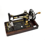 Two vintage hand sewing machines, one Singer Manufacturing Co, and one other cased example (2).