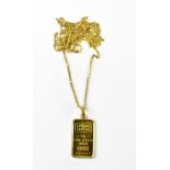 A 5g fine gold 999,9 tablet numbered 558940, in an 18ct gold pendant mount and hoop,