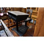 A vintage cast iron and wooden school desk with rotating lift-up seat, 72 x 61cm.