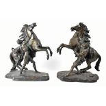 AFTER GUILLAUME COUSTOU (1677-1746); a pair of large late 19th century bronze Marley horses,