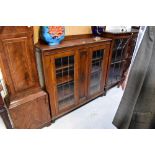 An early 20th century oak two-door display cabinet,