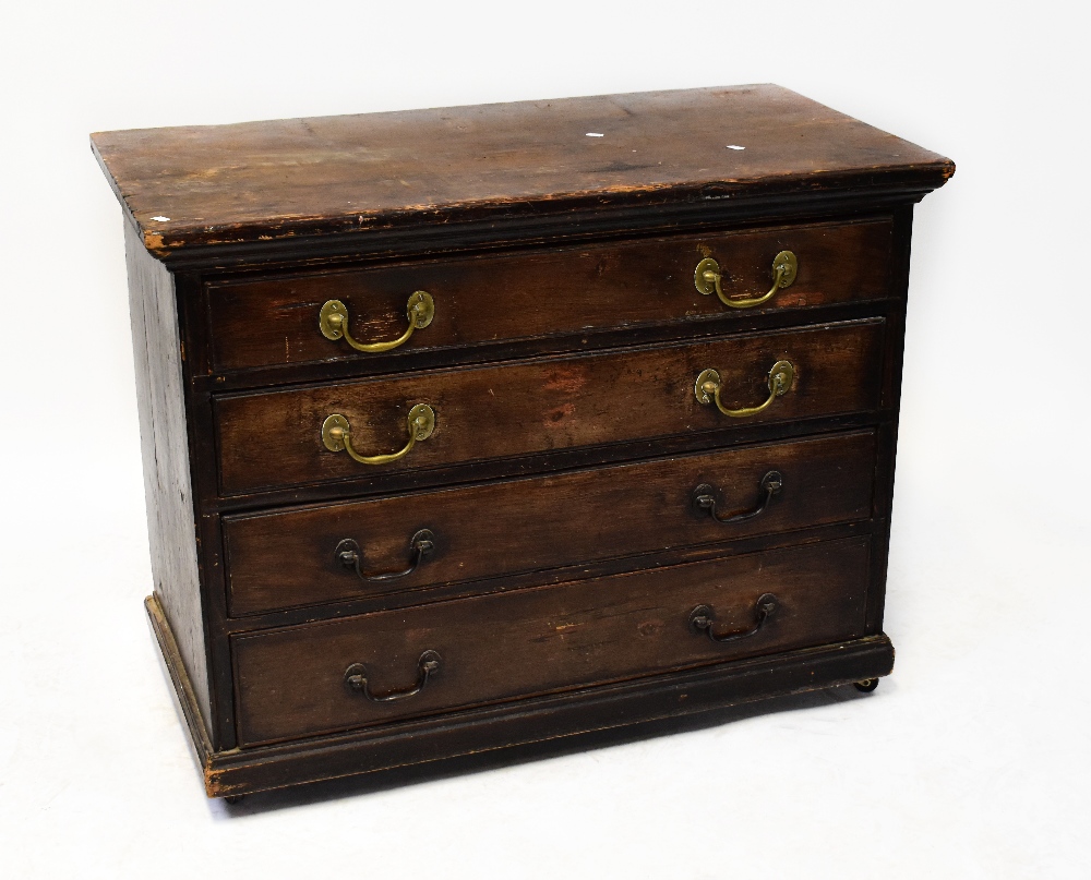 An early 20th century stained pine chest of four long drawers, to plinth base, raised on castors,