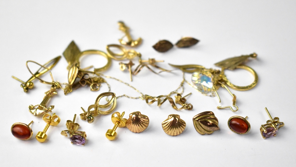 Ten pairs of mostly gold earrings of various styles and shapes, combined approx 10g.