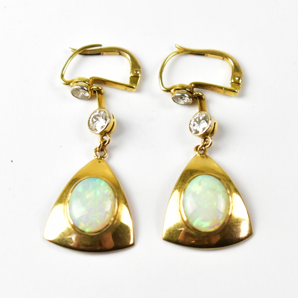 A pair of opal and diamond set earrings.