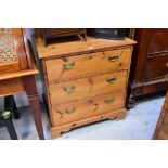 A modern pine chest of three drawers, with brass swing handles, on bracket feet, 81 x 76 x 56cm.