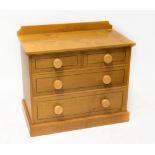 A modern oak bespoke made chest of two short over two long drawers,