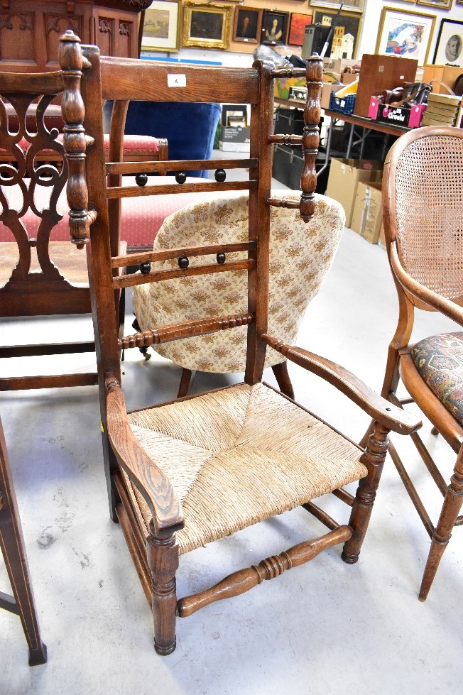 A late 18th/early 19th century rush seated low chair with high back,
