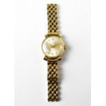 ACCURIST; a ladies' 9ct gold wristwatch, the dial set with Arabic numerals, approx 17.2g.