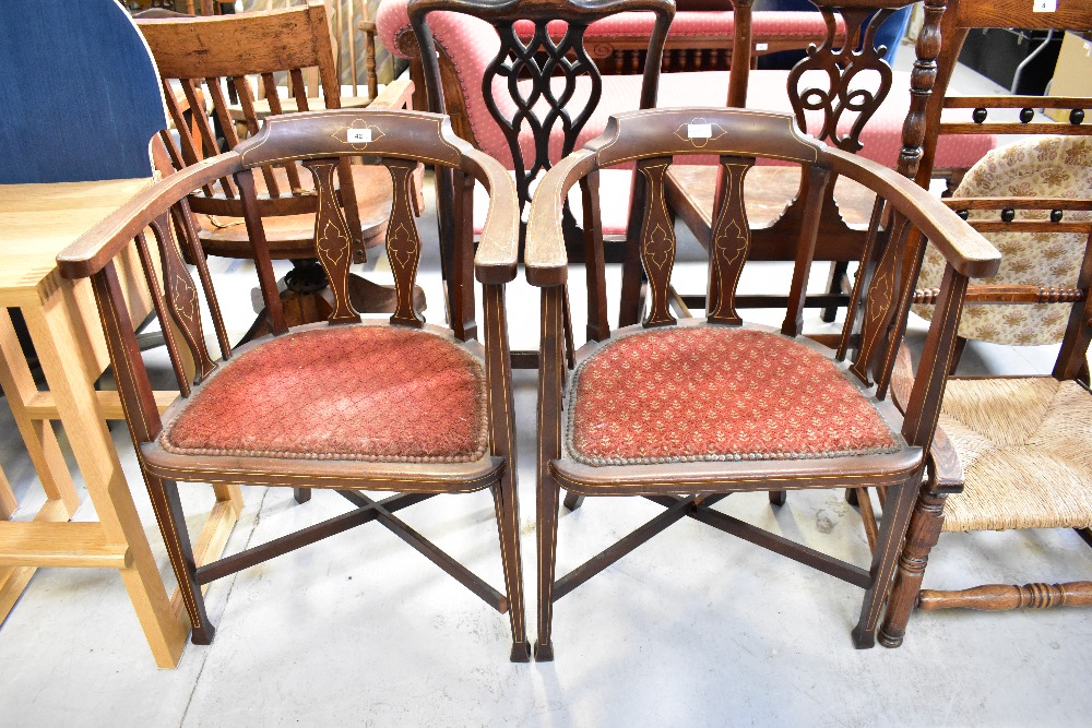 Two Edwardian mahogany desk/tub chairs with string inlay to back, arms and legs,