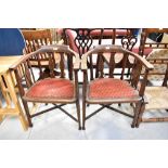 Two Edwardian mahogany desk/tub chairs with string inlay to back, arms and legs,