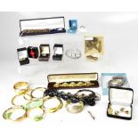 A large quantity of costume jewellery to include bangles, necklaces, bracelets,