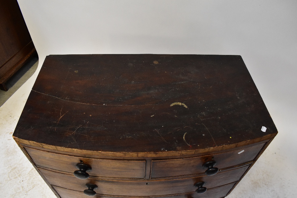 A Georgian mahogany bow-front chest of two short over two long drawers, above a shaped apron, - Image 2 of 2