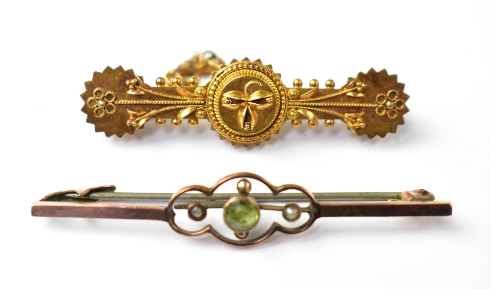 Two antique gold bar brooches comprising a 9ct gold bar brooch with bezel set peridot flanked by a